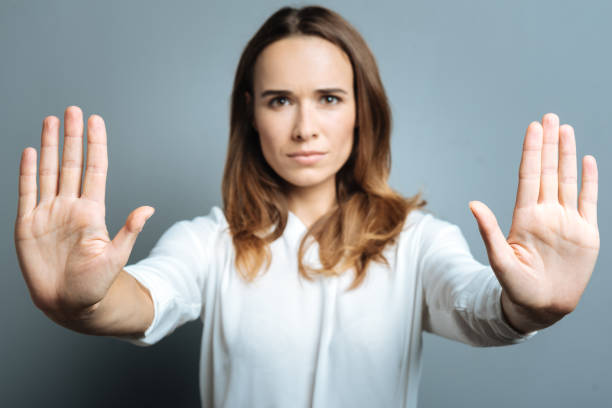 istock Serious nice woman showing her palms 845069080