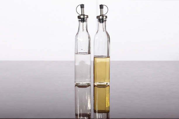 istock Olive oil and vinegar in bottles on a table 845070468
