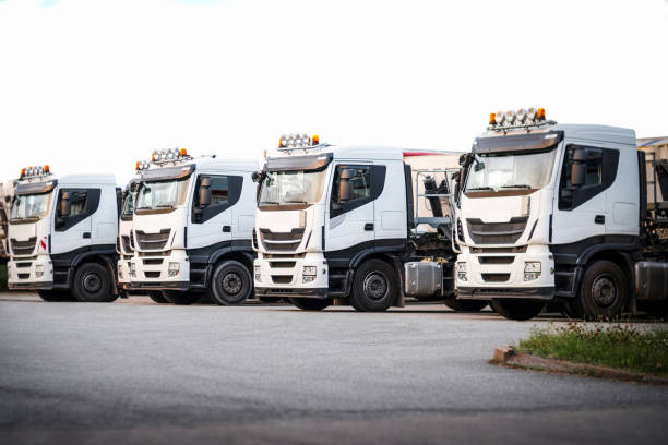 istock Parked white trucks in a row on a white background 845088318