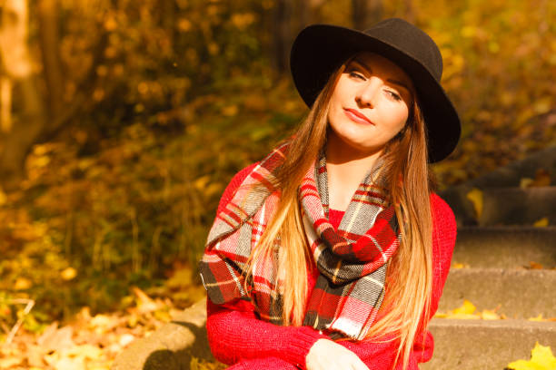 istock Woman walking in park during autumn 845100328