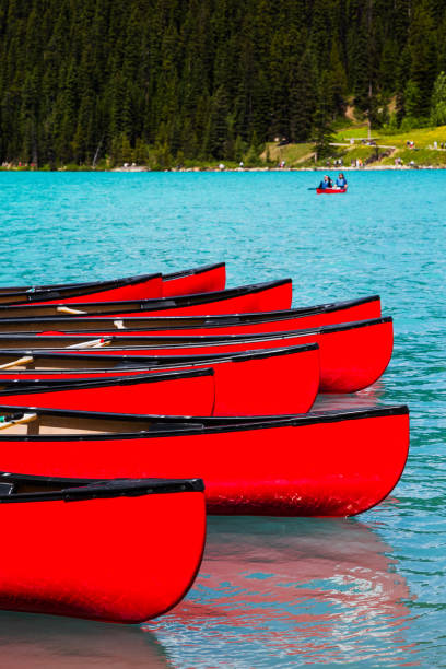 Canoes at Lake Louise, Banff National Park, Canada stock photo