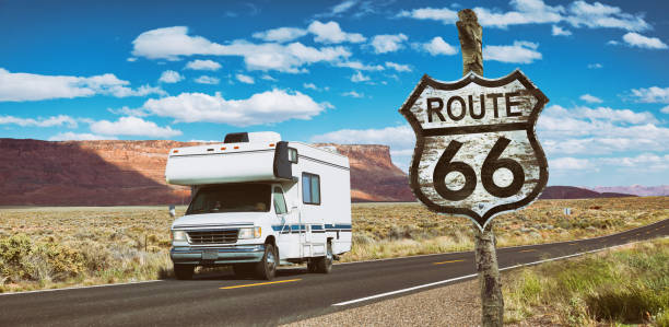 Driving motorhome through National Park USA on Route 66 Driving motorhome through National Park USA on Route 66 number 66 stock pictures, royalty-free photos & images