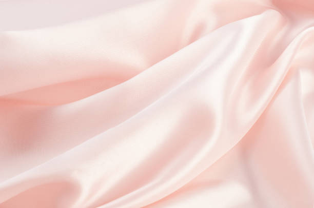 istock The texture of the silk fabric, soft pink 845108042