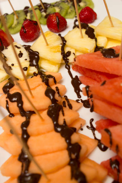 istock slice of various fruits covered with chocolate 845118972