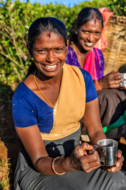 istock Tamil women drinking fresh tea on plantation, Ceylon 845120314