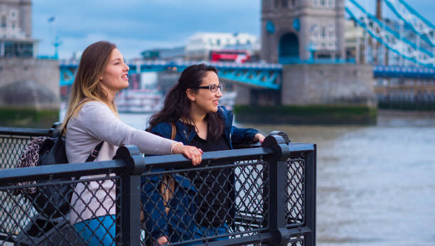 istock Two girlfriends in London - relaxing at Tower Bridge 845120360