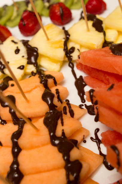 istock slice of various fruits covered with chocolate 845120654