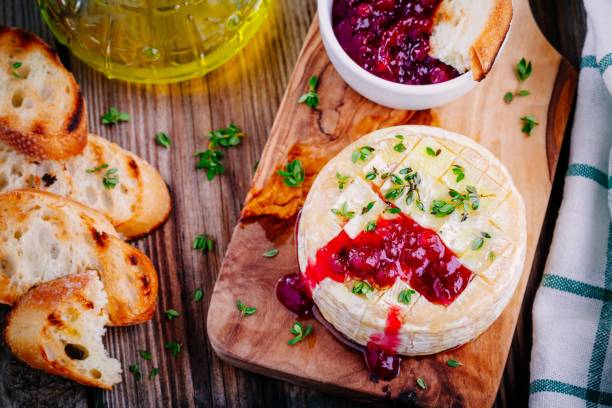 istock Baked camembert with cranberry sauce and thyme 845125444