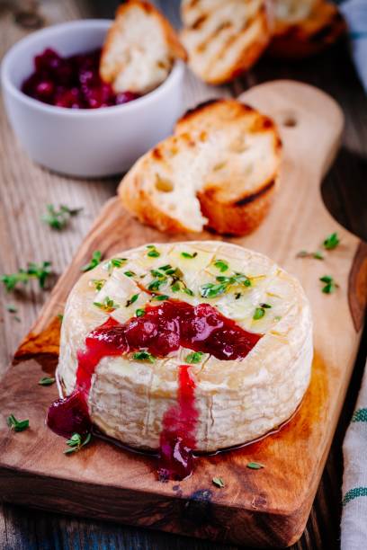 istock Baked camembert with cranberry sauce and thyme 845125640