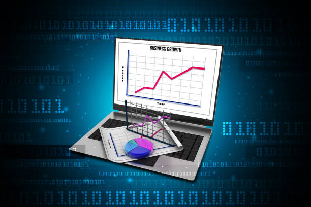 laptop showing a spreadsheet and a paper with statistic charts - 3498 imagens e fotografias de stock