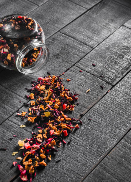 istock Spilled tea on wooden boards and a glass jar 845138380