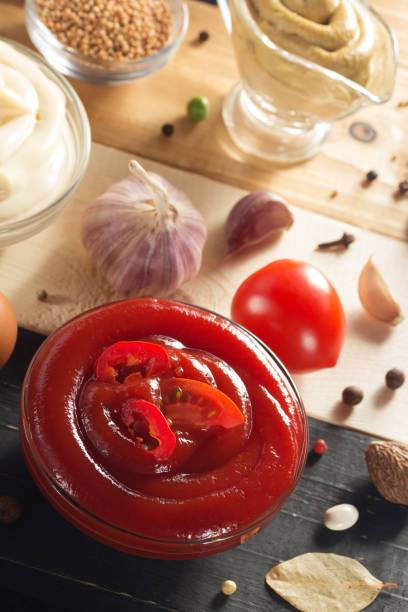 istock Tomato sauce on wooden background 845145260