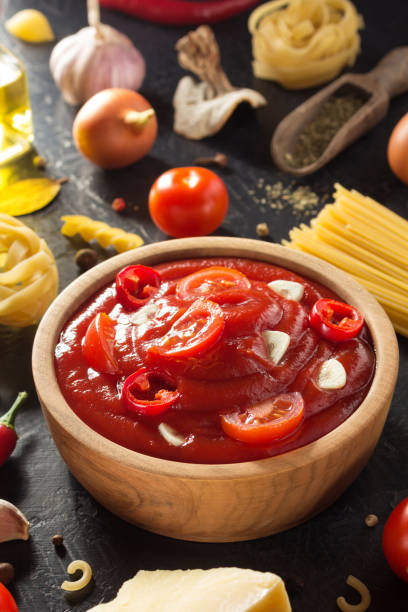 istock Tomato sauce on wooden background 845146208