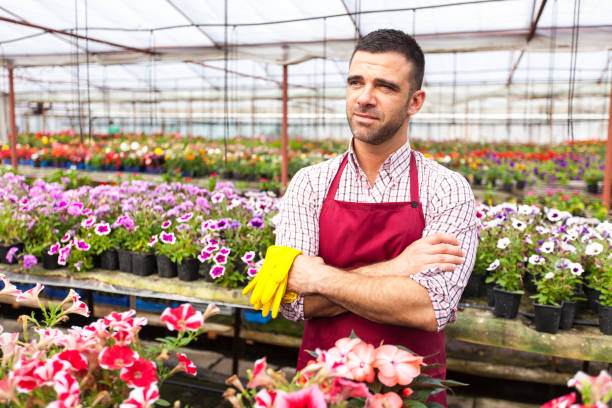 istock Greenhouse worker standing arms crossed 845151622