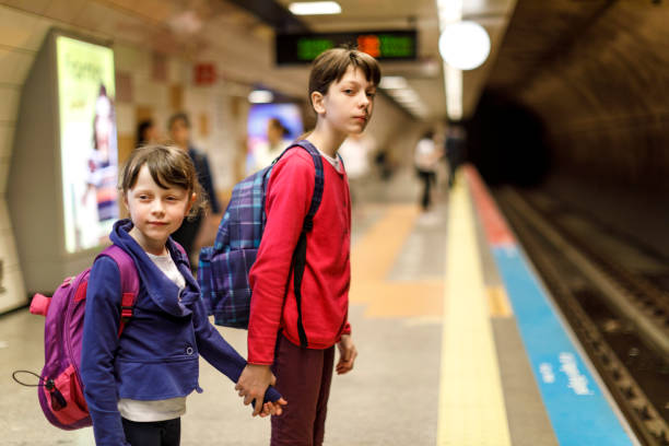 istock Kids waiting in the railway station 845161678