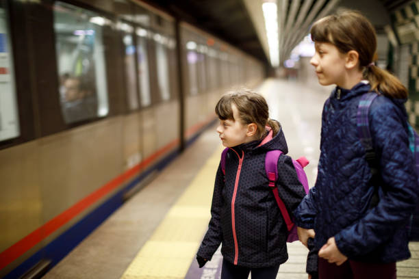 istock Kids entering in commuter subway train 845163852