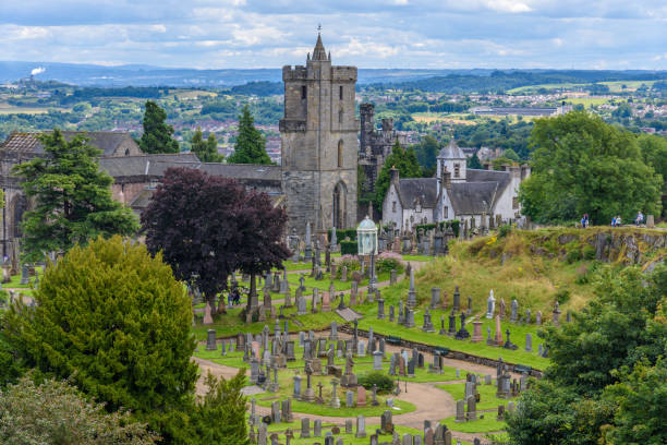 Stirling - United Kingdom - August 9, 2017: View of cemetery near Stirling Castle in Scotland with some tourists visiting it