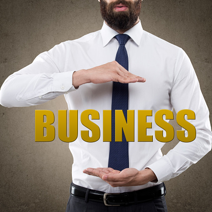 Businessman securing single word business