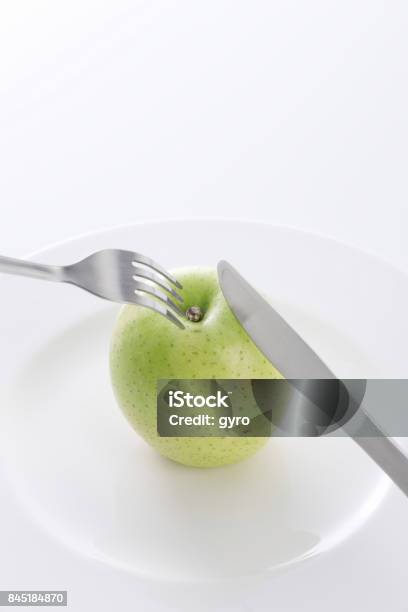 Green Apple With Fork Stock Photo - Download Image Now - Apple - Fruit, Beauty, Crockery