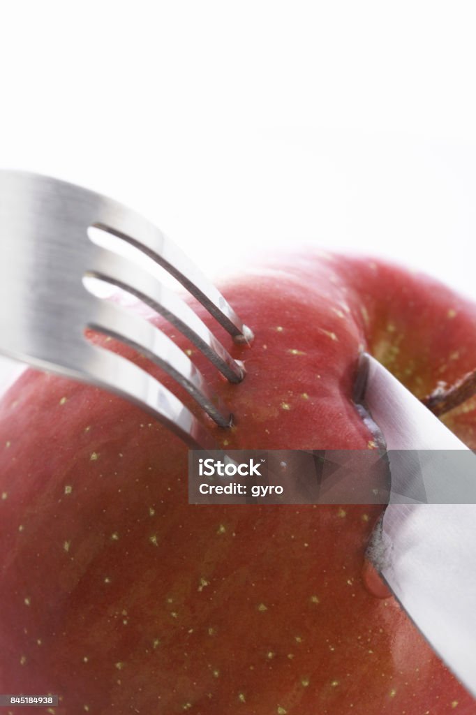 Apple with fork Apple - Fruit Stock Photo