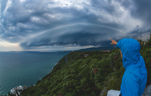 Selfie taken in the storm with a beautiful shelf cloud approaching the land
