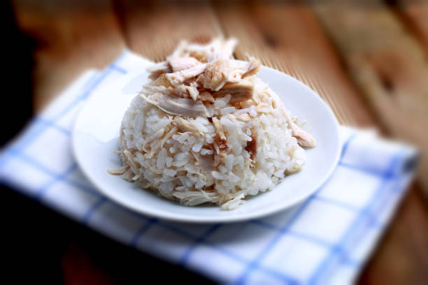 Chicken with piece rice Chicken with piece rice on wooden floor. pilau rice stock pictures, royalty-free photos & images