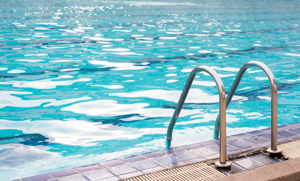 istock Grab bars ladder in the blue swimming pool 845194290