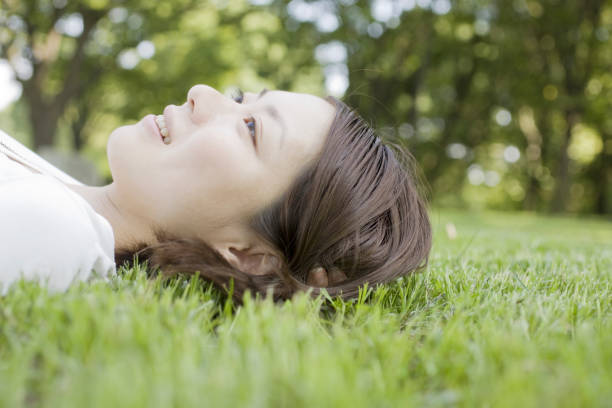 istock Woman laying on the grass 845197996