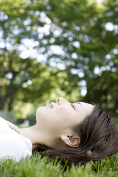 istock Woman laying on the grass 845198004