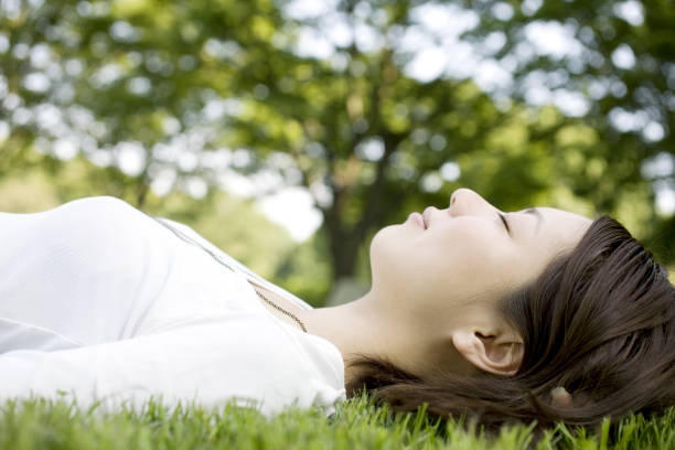 istock Woman laying on the grass 845198010