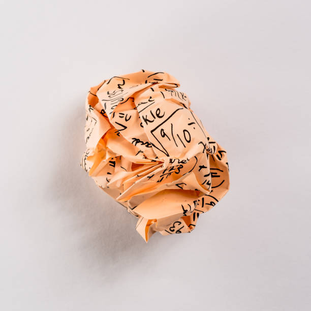istock Crumpled colored paper ball with mathematical equations on it placed on the crumpled paper 845202370