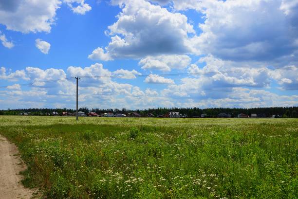 istock green field and blue sky with clouds 845212448