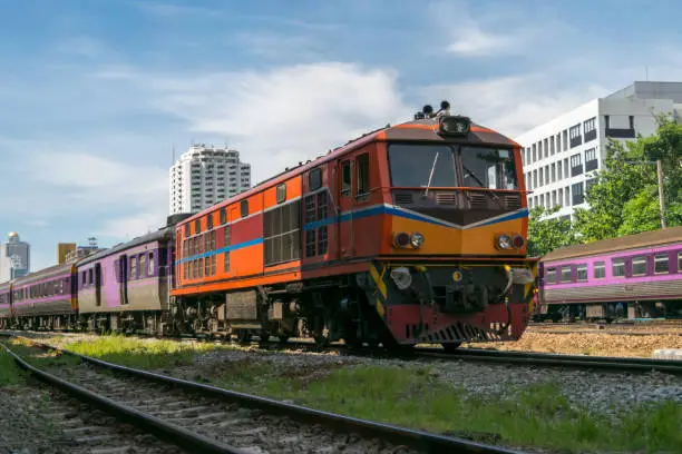 Photo of Railway train run on the railroad tracks. Many people in Thailand popular travel by train because it is cheaper.