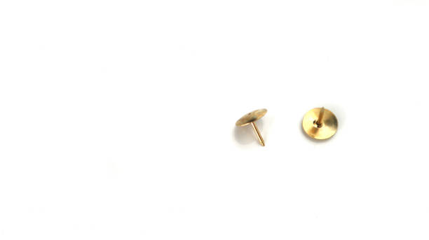 istock Gold push pins isolated on white background 845223844