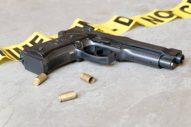 istock Crime scene concept with gun and three casings 845225204