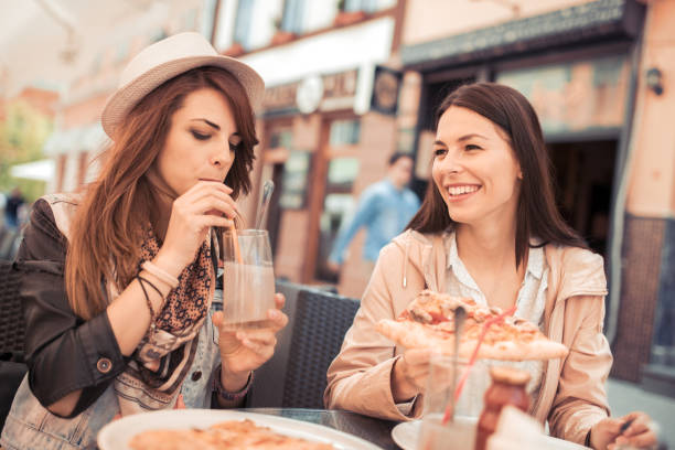 istock Two woman relaxing in the city 845231422