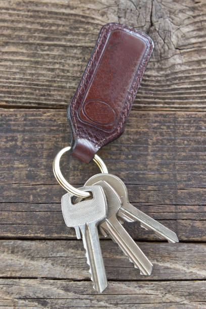 istock Keys with leather tag on wooden background 845243340