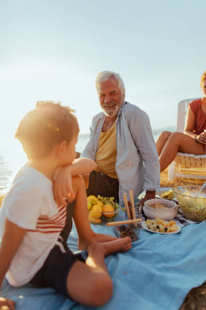 istock Seaside picnic with grandparents 845256812