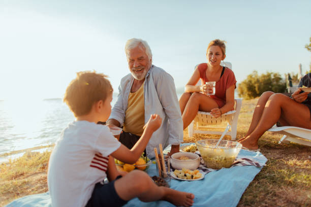 istock Seaside picnic with family 845259448