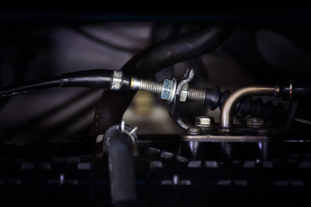 The throttle cable of the engine. The throttle cable of the engine is installed in the engine compartment of the car. Automotive part concept. throttle photos stock pictures, royalty-free photos & images