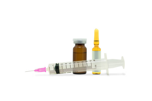 istock Medical syringe and dose bottle. 845260580
