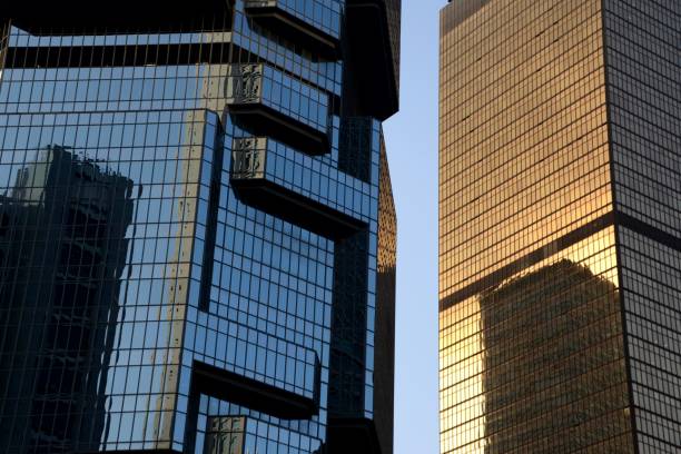 Lippo Centre and Far East Finance building, postmodern architecture in Hong Kong Postmodern buildings in Hong Kong island, On the left side, the Lippo Centre, a twin-tower skyscraper, also called "The Koala Tree" because of the bizarre architectures resemble koalas clutching a tree, the highest tower is 186 mt tall. On the right, the golden Far East Finance centre, a 176 mt tall office skyscraper. lippo centre stock pictures, royalty-free photos & images