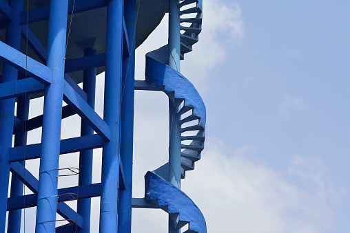 High resolution image of spiral staircase approaching elevated water reservoir