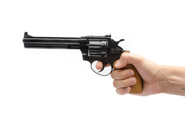 istock revolver in hand isolated on white 845270816