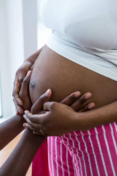 istock Man touching pregnant woman belly 845274066
