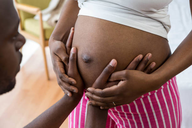 istock Man touching pregnant woman belly 845274082
