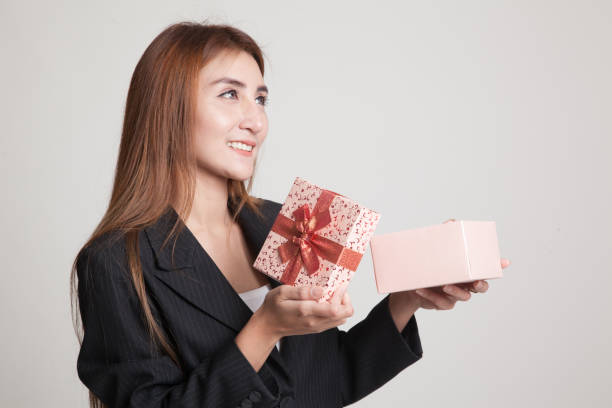 istock Young Asian woman open a gift box. 845283466