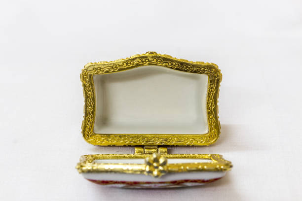 istock Tiny colorful jewel box with gold platted crimp in a white background. Macro with extremely shallow depth of field. Selective focus on the jewel box. 845289652