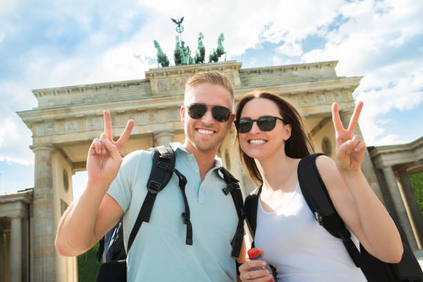 istock Happy Couple Making Peace Sign 845289686