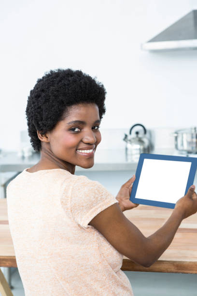 istock Pregnant woman using digital tablet in kitchen 845292858